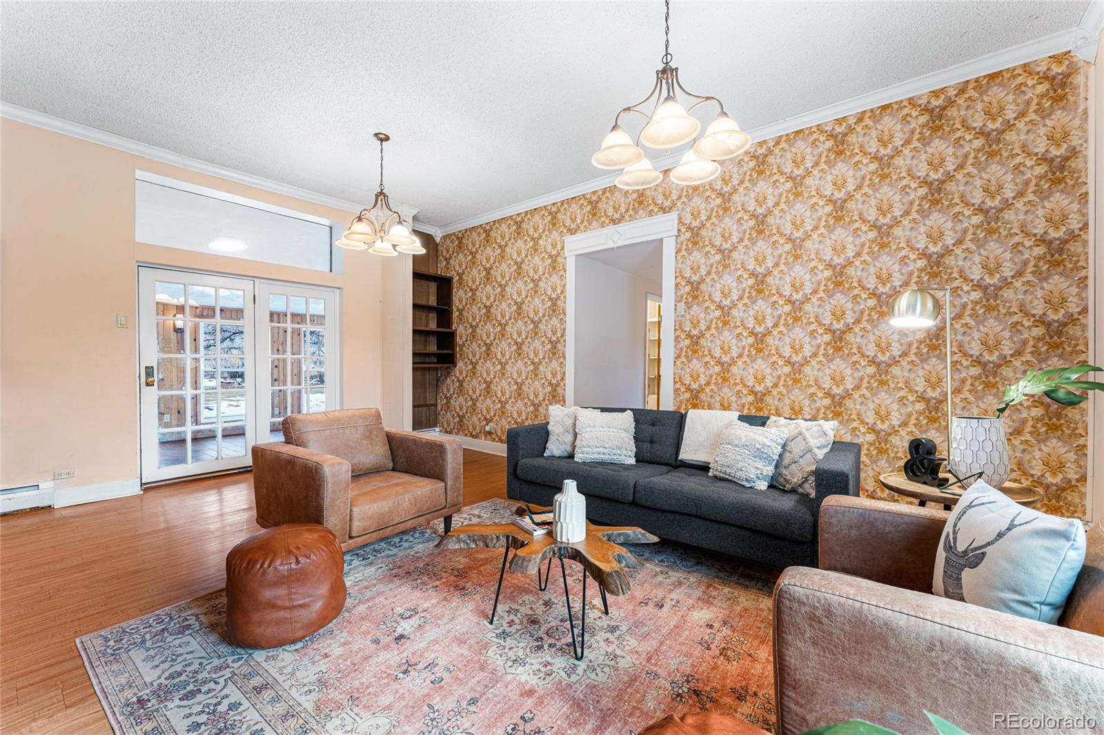 3152 Indian Road Boulder, CO 80301 - Photo 9 of 49 a living room with furniture a rug and a chandelier