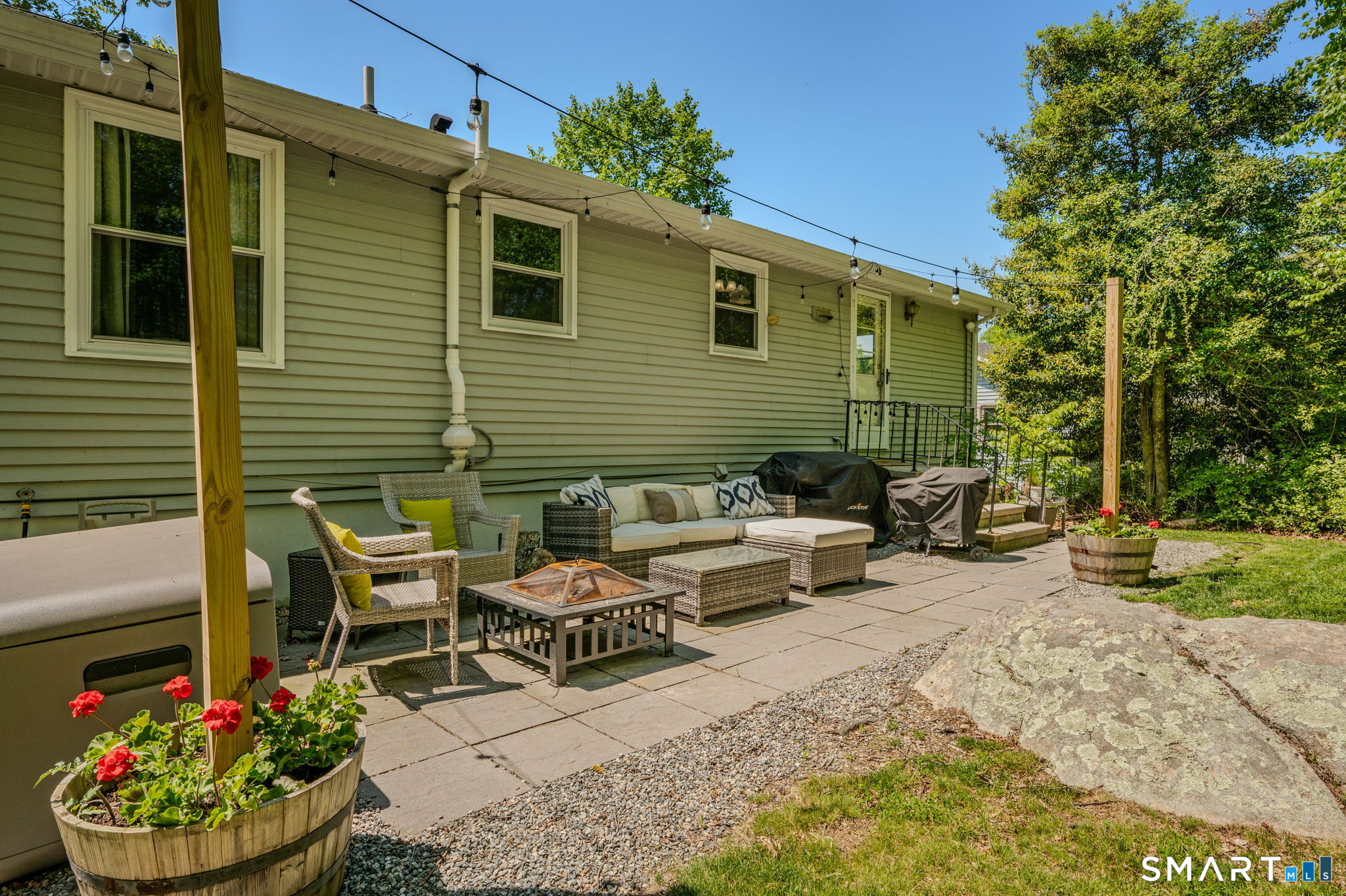 6 Amherst Court Groton, CT 06355 - Photo 33 of 40 a view of a chairs and table in backyard of the house