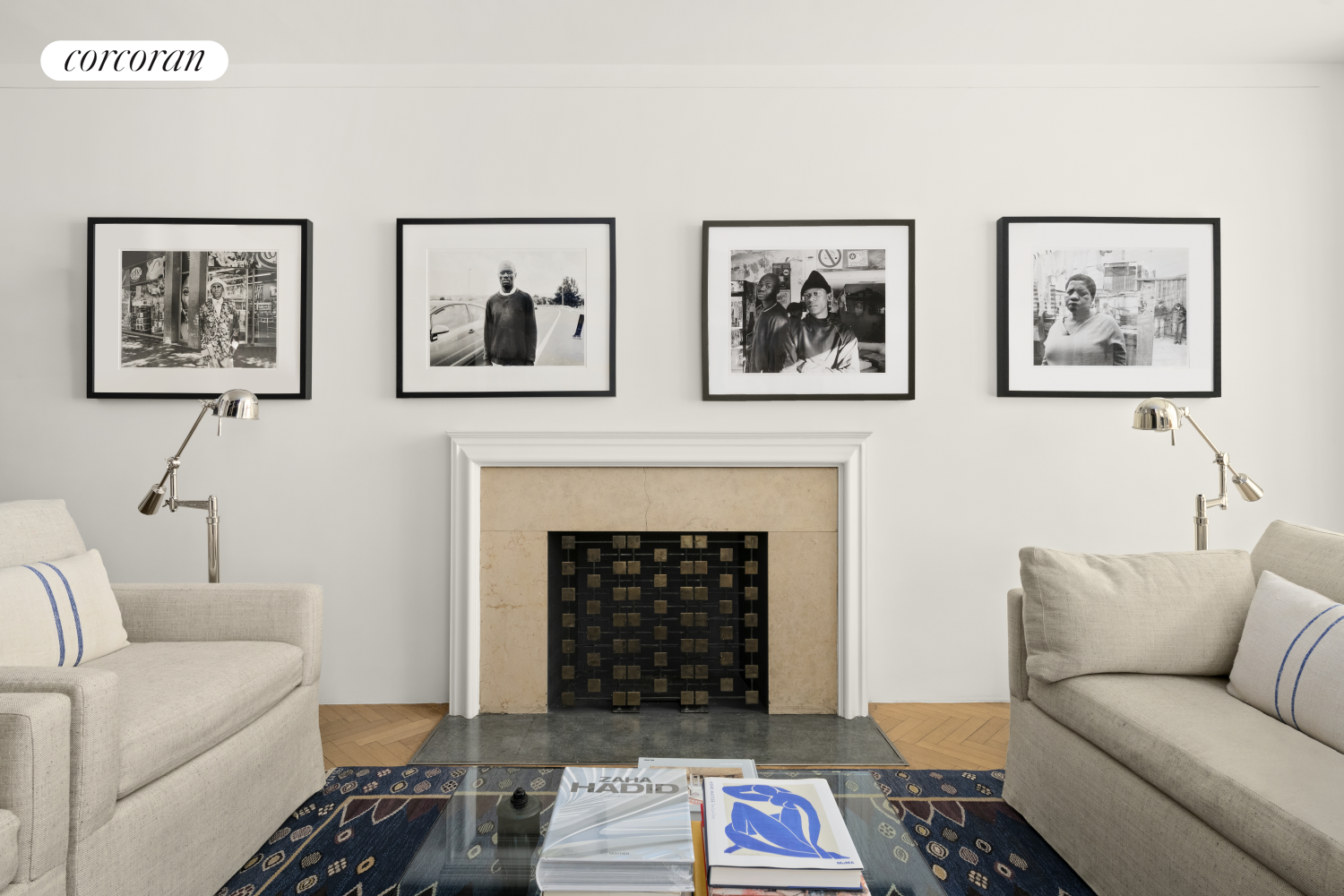 24 West 55th Street, Unit 7F Manhattan, NY 10019 - Photo 2 of 10 a living room with furniture and a fireplace