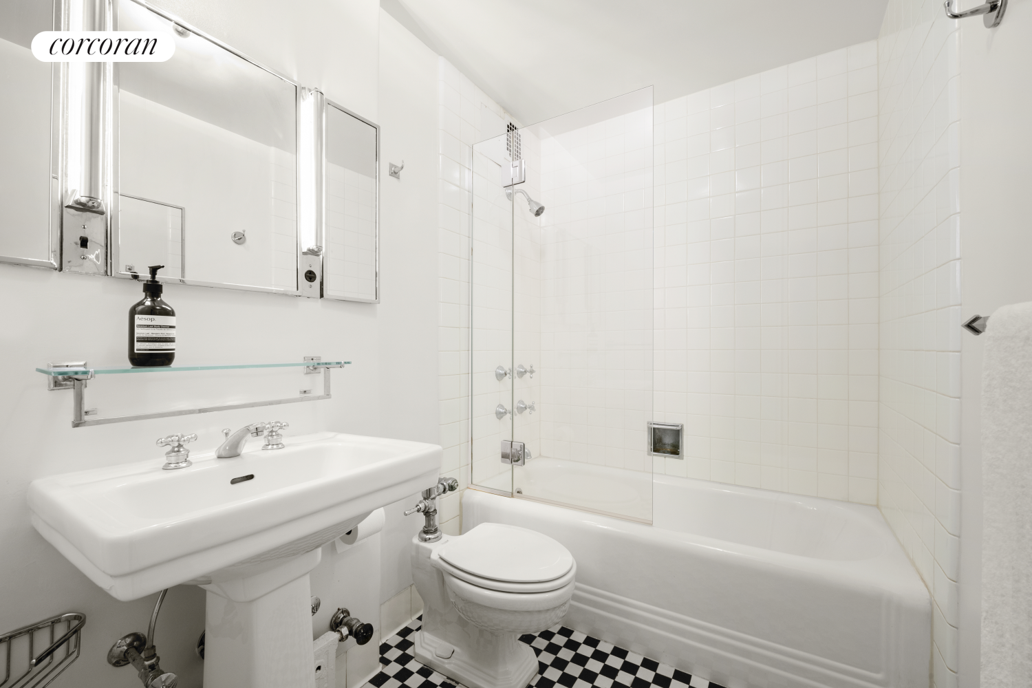 24 West 55th Street, Unit 7F Manhattan, NY 10019 - Photo 7 of 10 a bathroom with a sink toilet and shower