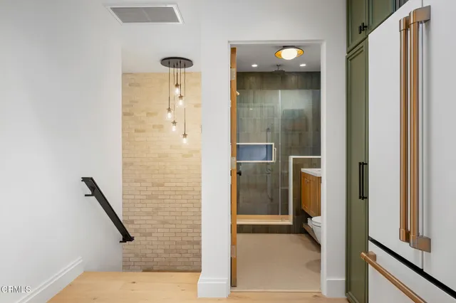 a bathroom with a shower and a sink