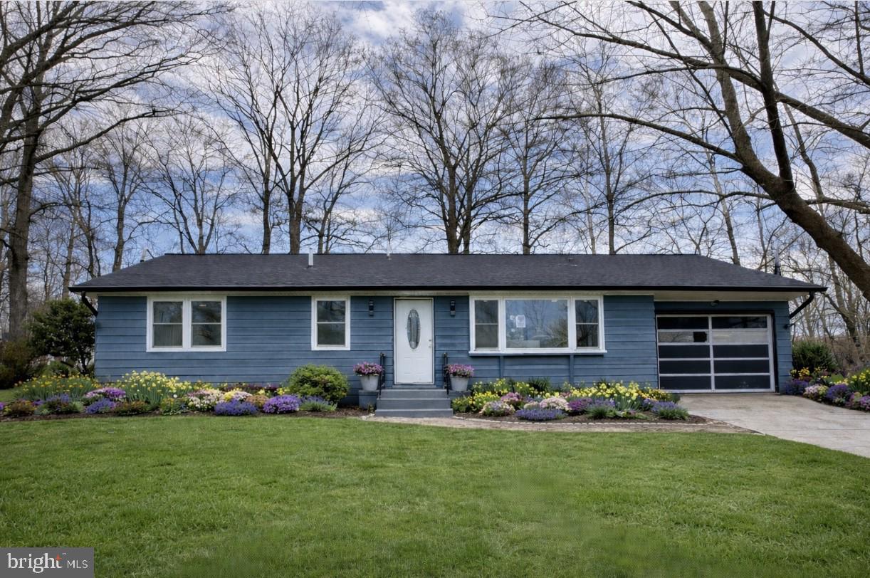 12235 Legore Bridge Road Woodsboro, MD 21798 - Photo 1 of 2 a front view of a house with garden