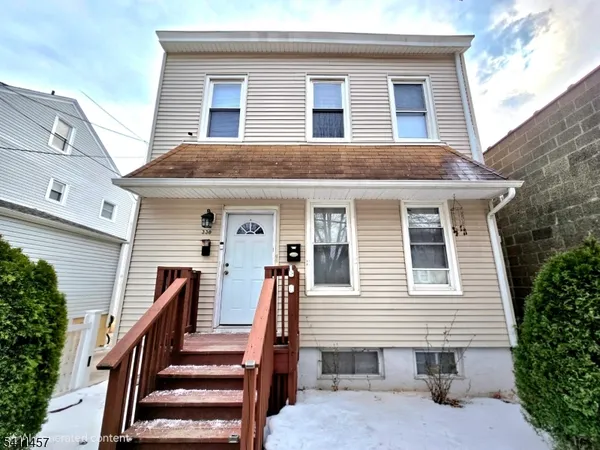 a front view of house with stairs