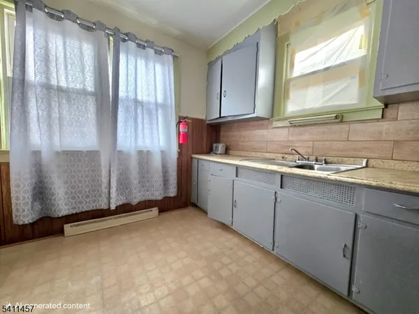 a kitchen with a sink and cabinets