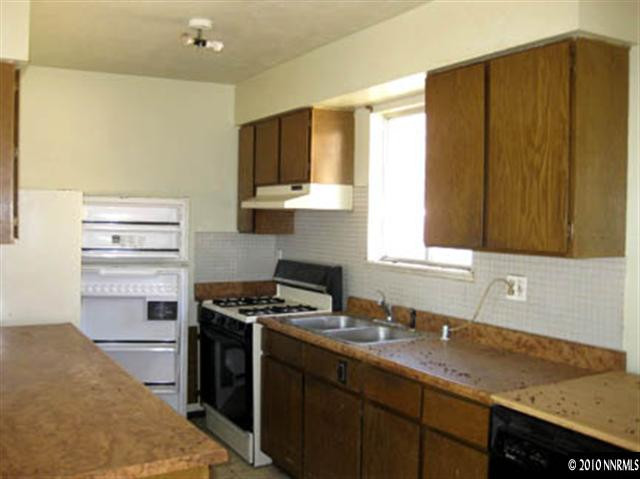 6400 Lost Springs Road Reno, NV 89510 - Photo 8 of 13 a kitchen with stainless steel appliances a sink stove and cabinets