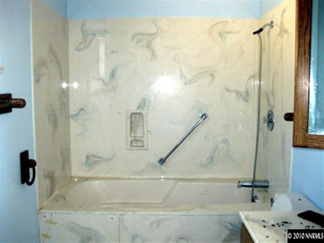 6400 Lost Springs Road Reno, NV 89510 - Photo 10 of 13 a bathroom with a shower and a tub