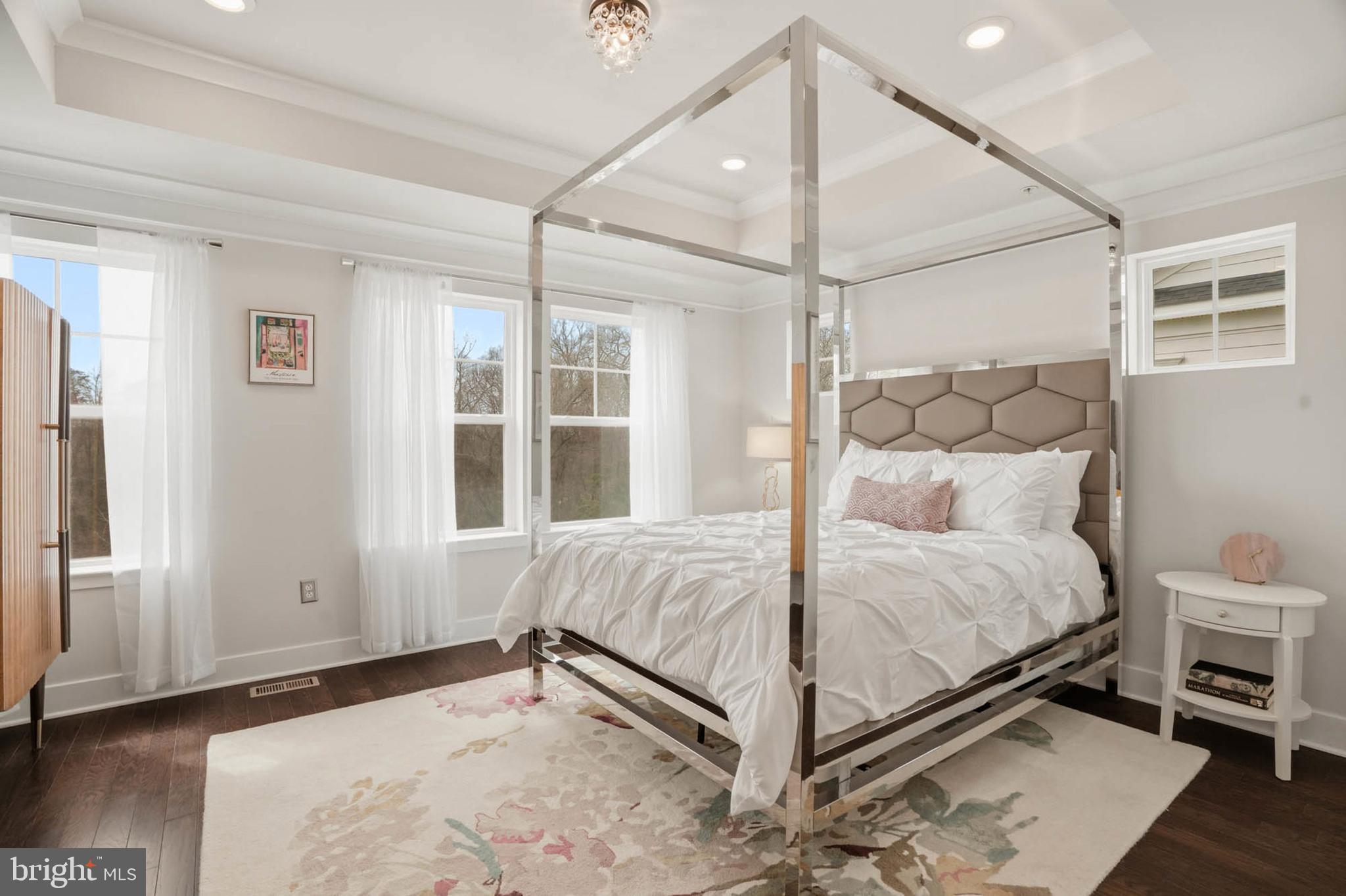 110 Bonny Way Annapolis, MD 21403 - Photo 19 of 35 a bed sitting in a bedroom next to a window and a chandelier