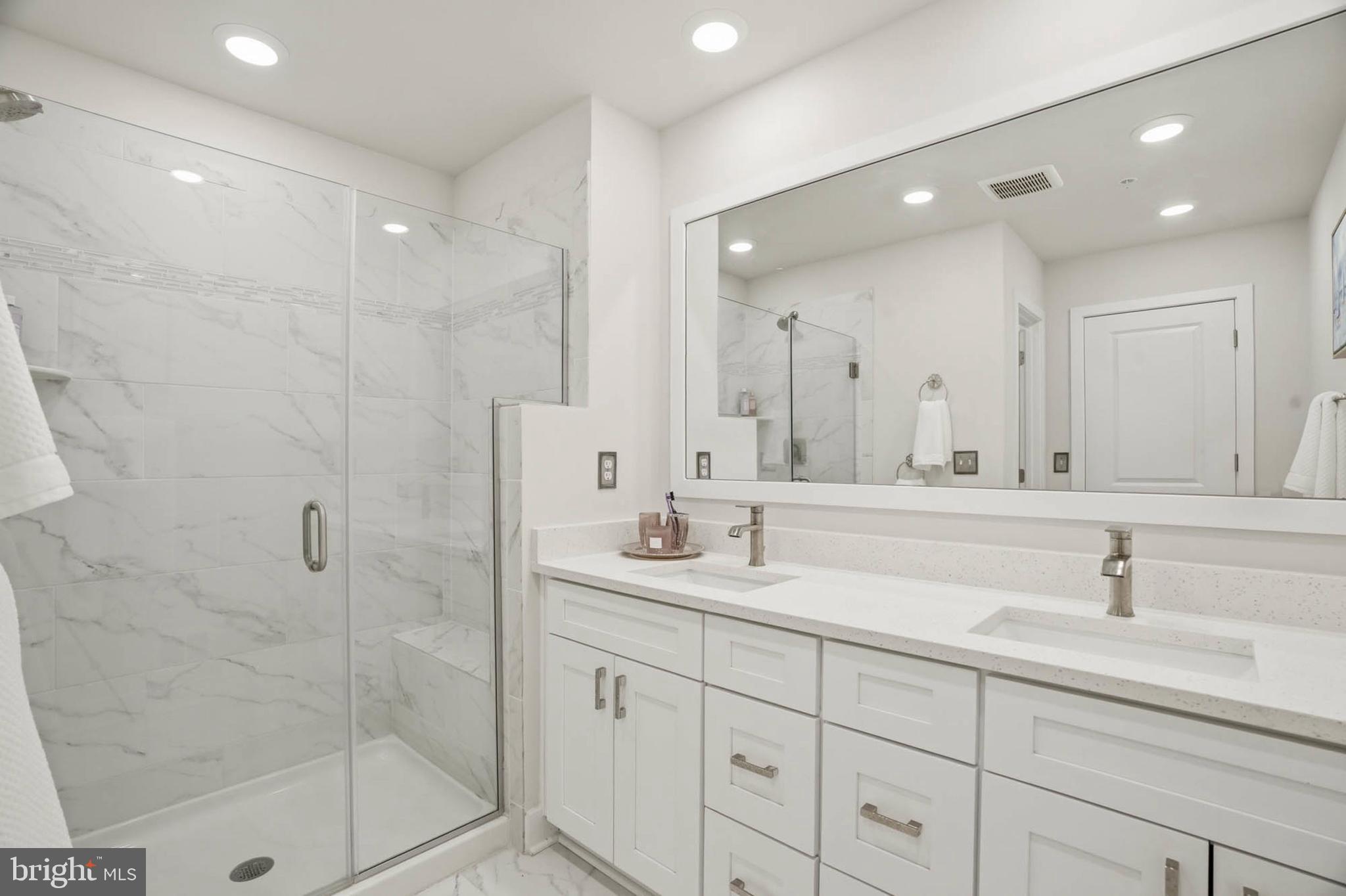 110 Bonny Way Annapolis, MD 21403 - Photo 21 of 35 a bathroom with double sink shower and two mirror