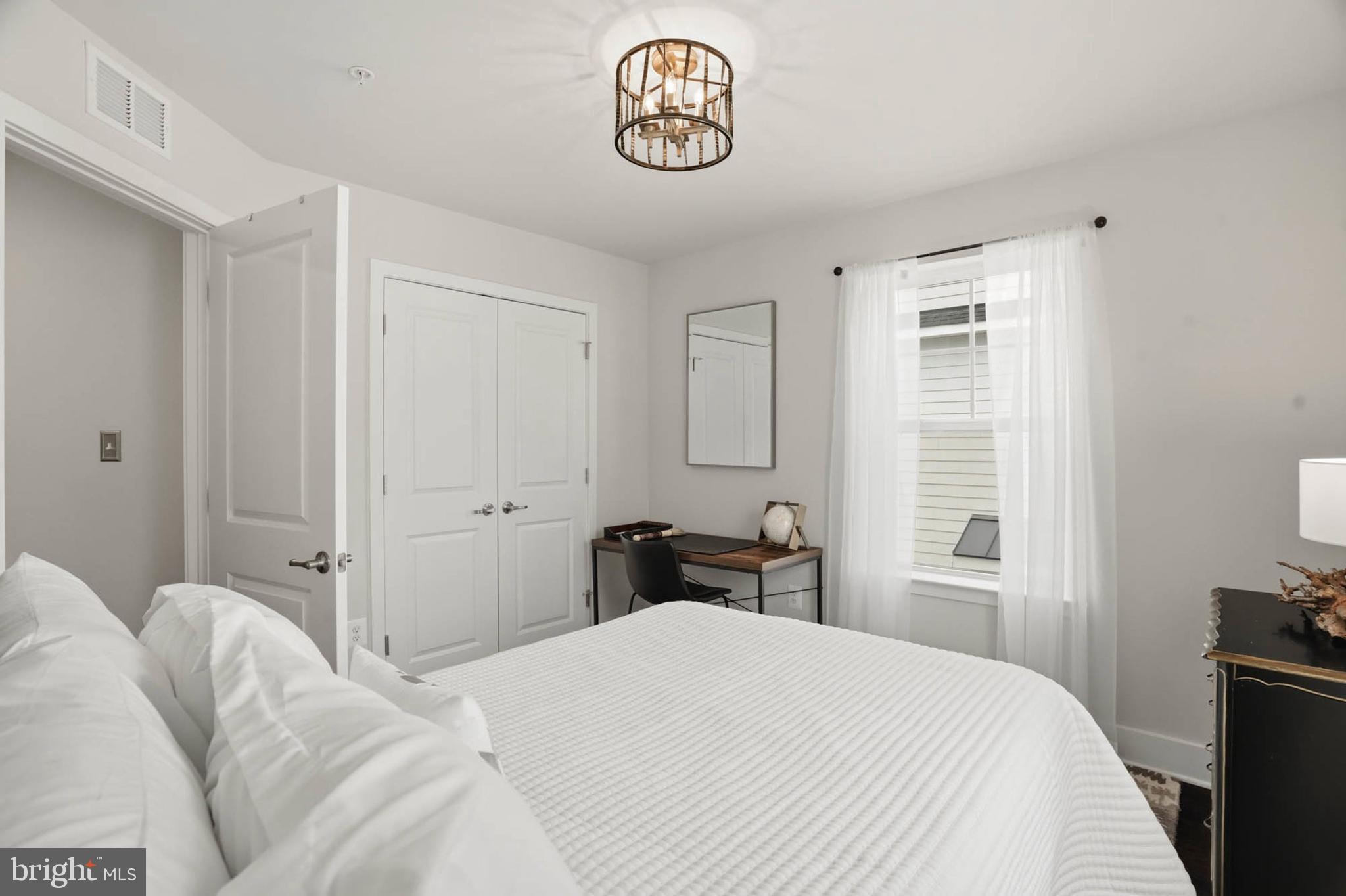 110 Bonny Way Annapolis, MD 21403 - Photo 24 of 35 a bedroom with a bed and a table in it
