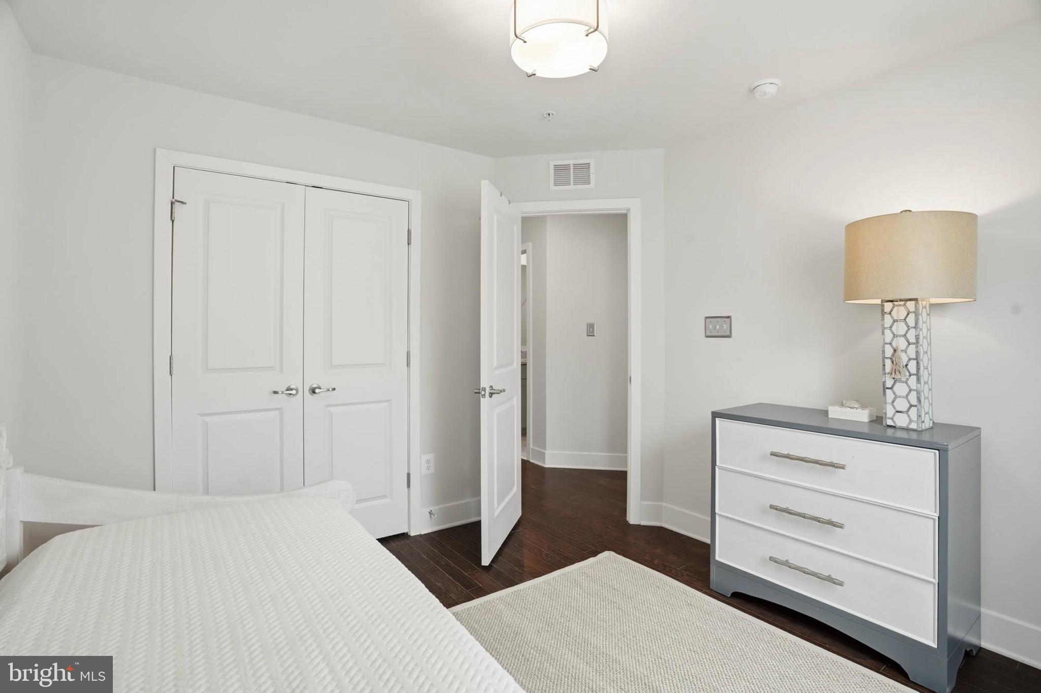 110 Bonny Way Annapolis, MD 21403 - Photo 28 of 35 a bedroom with a bed and a lamp
