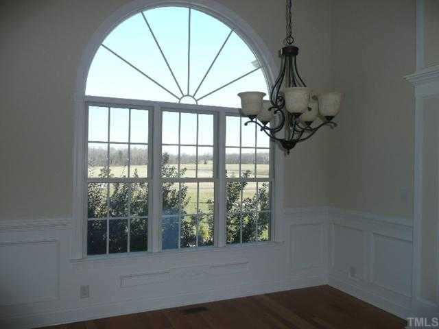 2207 Moores Mill Road Rougemont, NC 27572 - Photo 5 of 12 Triple Window with Palladium Top Window, Wainscotting, Hardwoods, Crown Molding and 12ft Ceiling! Look at that View from the Formal Dining Area! Dining Room