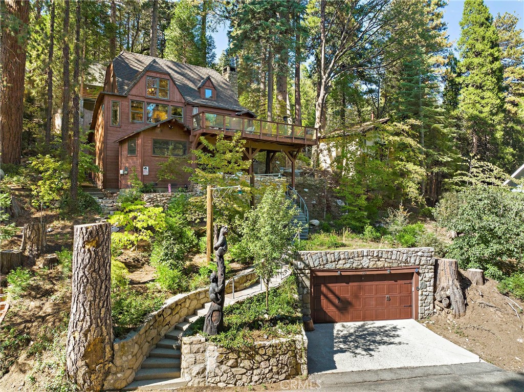front view of a house with a tree