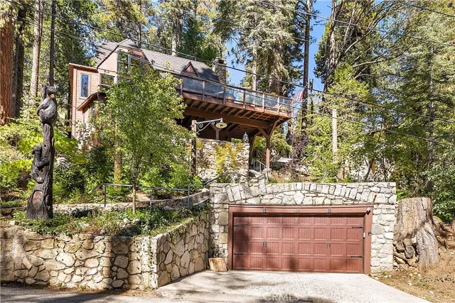 a open kitchen with stainless steel appliances granite countertop a stove kitchen island a dining table and chairs with wooden floor