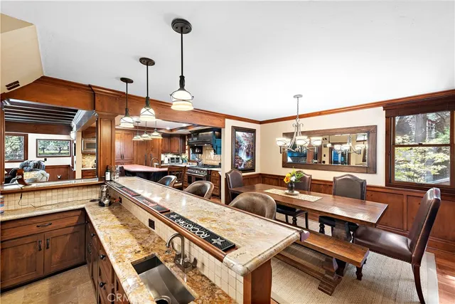 a outdoor dining space with furniture and wooden floor