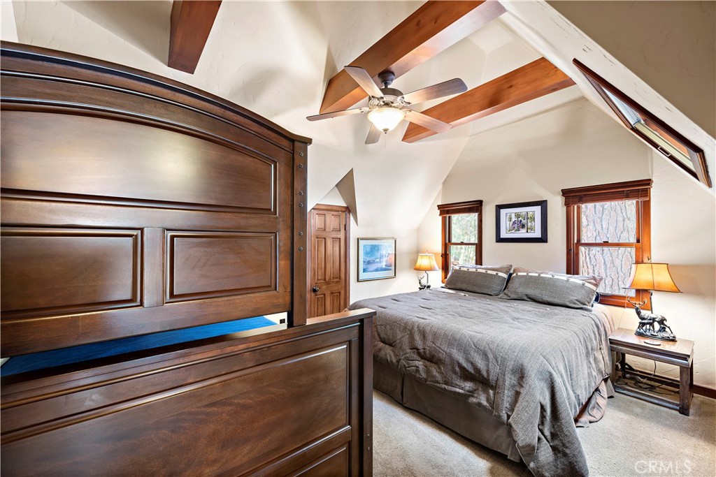 400 Cottage Grove Road Lake Arrowhead, CA 92352 - Photo 31 of 70 a bedroom with a bed and wooden floor