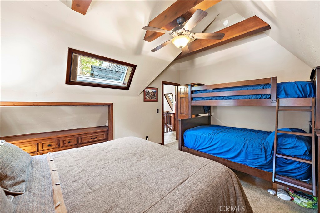 400 Cottage Grove Road Lake Arrowhead, CA 92352 - Photo 32 of 70 a bedroom with a bed and a flat screen tv