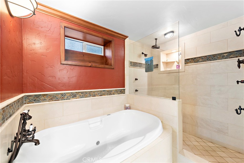 400 Cottage Grove Road Lake Arrowhead, CA 92352 - Photo 40 of 70 a bathroom with a tub and shower