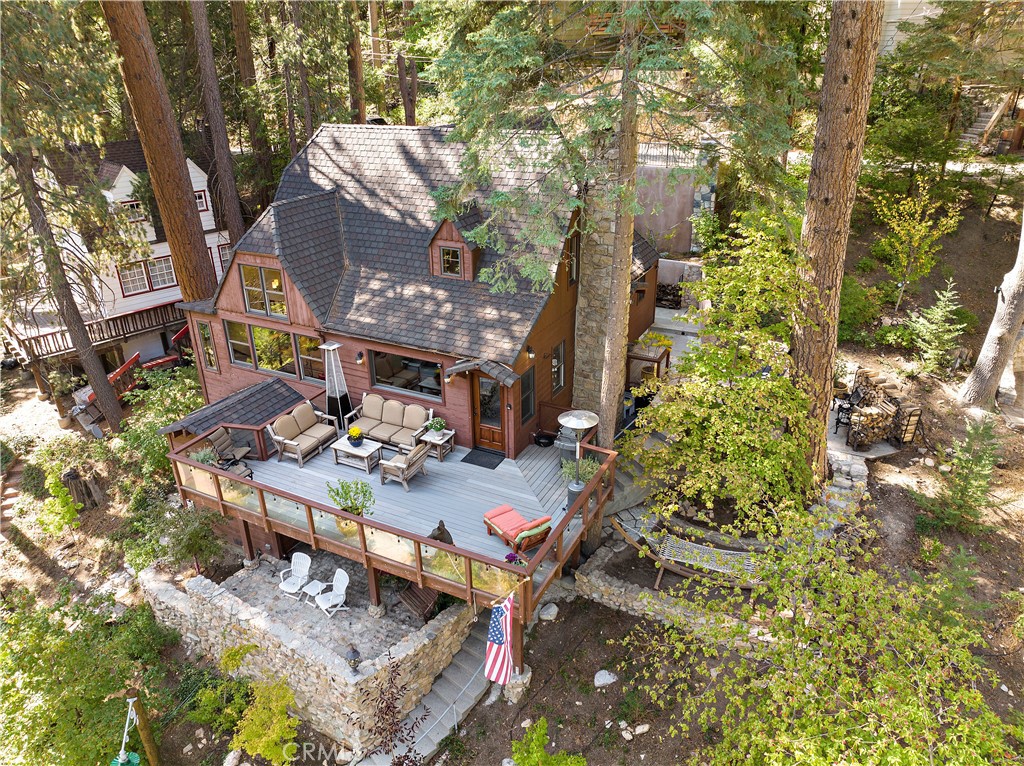 400 Cottage Grove Road Lake Arrowhead, CA 92352 - Photo 51 of 70 a view of a patio with table and chairs and potted plants