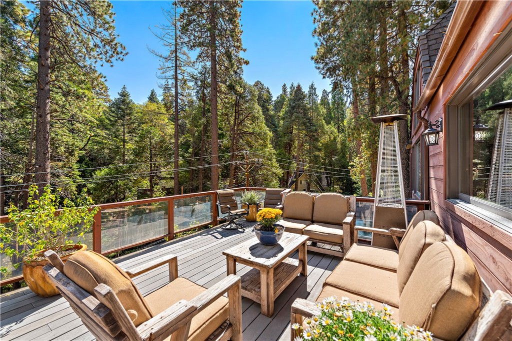 400 Cottage Grove Road Lake Arrowhead, CA 92352 - Photo 9 of 70 a view of a patio with couches table and chairs and potted plants