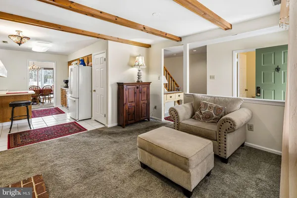 a living room with furniture and a rug