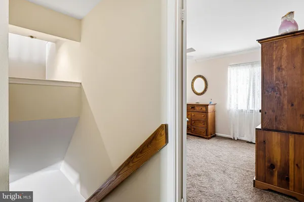 a view of an empty room and fire place