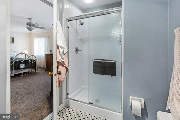 a bathroom with a shower and a sink