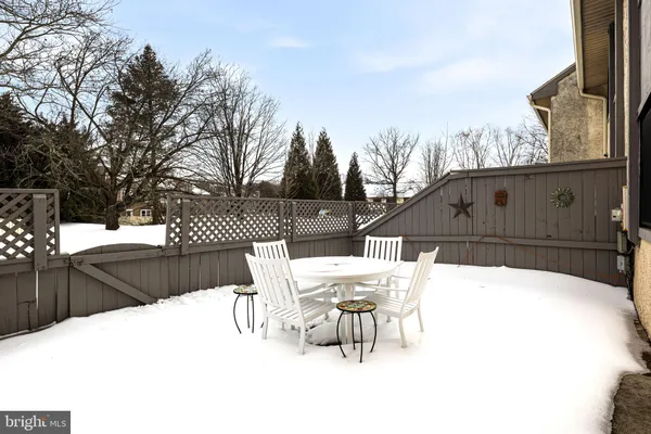 a view of backyard with a patio and outdoor seating