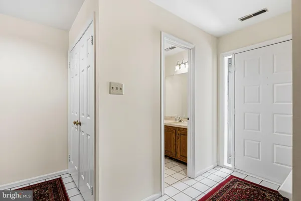a view of an entryway with wooden floor