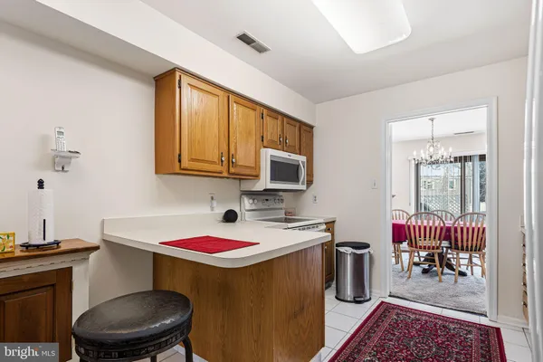a bathroom with a toilet a sink and a mirror