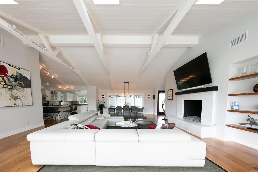 6145 La Flecha, Unit 4 Rancho Santa Fe, CA 92067 - Photo 1 of 26 a living room with furniture and a flat screen tv