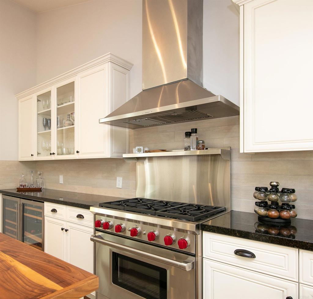 6145 La Flecha, Unit 4 Rancho Santa Fe, CA 92067 - Photo 12 of 26 a stove top oven sitting inside of a kitchen
