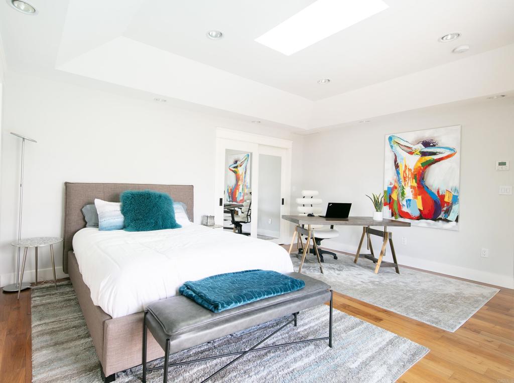 6145 La Flecha, Unit 4 Rancho Santa Fe, CA 92067 - Photo 14 of 26 a living room with furniture rug and wooden floor