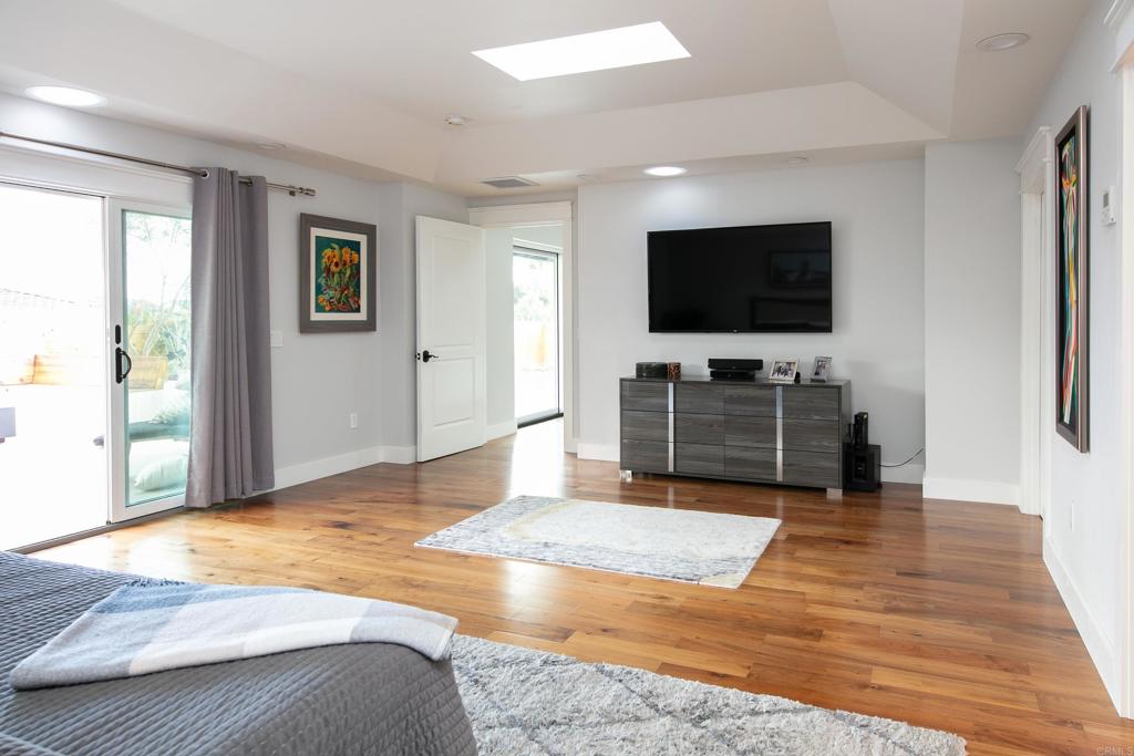 6145 La Flecha, Unit 4 Rancho Santa Fe, CA 92067 - Photo 17 of 26 a living room with furniture and a flat screen tv