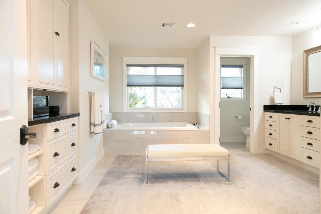 6145 La Flecha, Unit 4 Rancho Santa Fe, CA 92067 - Photo 19 of 26 a spacious bathroom with bathtub a flat screen tv and a window