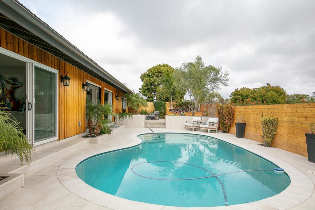 6145 La Flecha, Unit 4 Rancho Santa Fe, CA 92067 - Photo 22 of 26 a view of a swimming pool with a patio