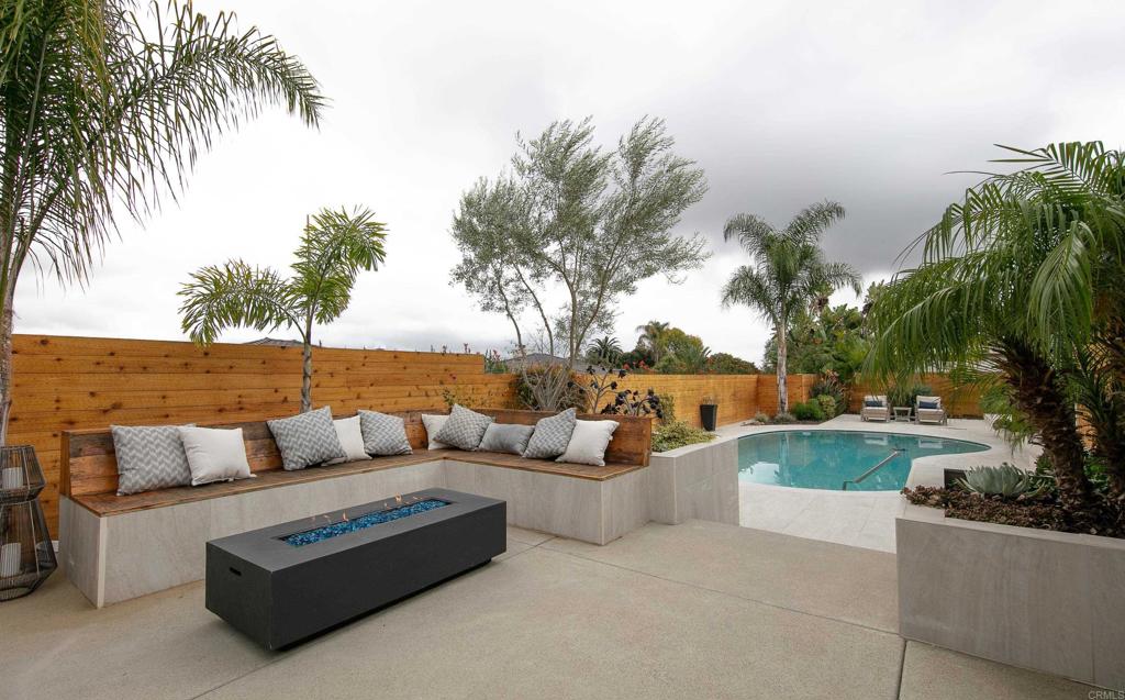6145 La Flecha, Unit 4 Rancho Santa Fe, CA 92067 - Photo 24 of 26 a view of patio with couches and a fire pit