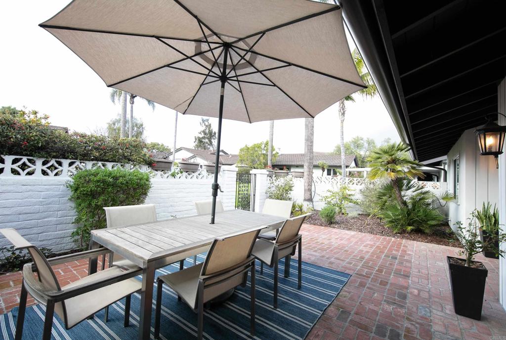 6145 La Flecha, Unit 4 Rancho Santa Fe, CA 92067 - Photo 5 of 26 a view of a patio with furniture and yard