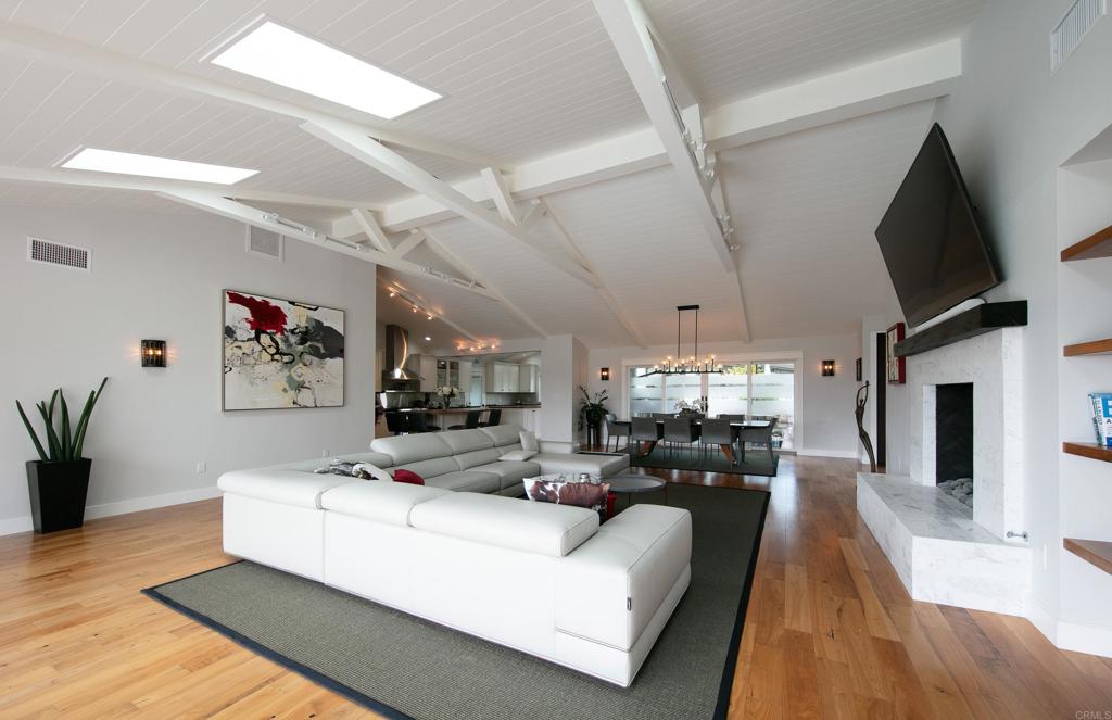 6145 La Flecha, Unit 4 Rancho Santa Fe, CA 92067 - Photo 6 of 26 a living room with furniture and a flat screen tv