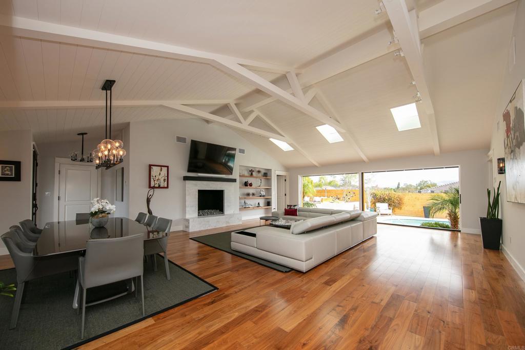 6145 La Flecha, Unit 4 Rancho Santa Fe, CA 92067 - Photo 8 of 26 a living room with fireplace furniture and a wooden floor
