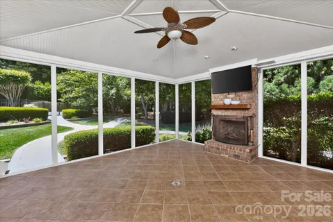 a view of a porch with furniture and garden