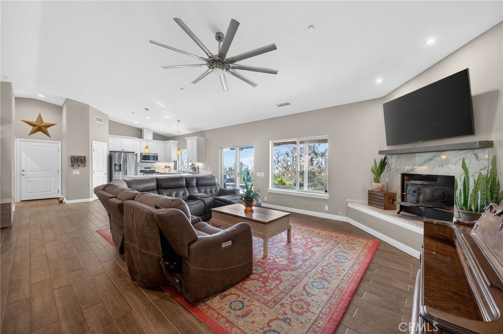 2914 Vista Del Rio Fallbrook, CA 92028 - Photo 35 of 57 a living room with furniture a flat screen tv and a fireplace