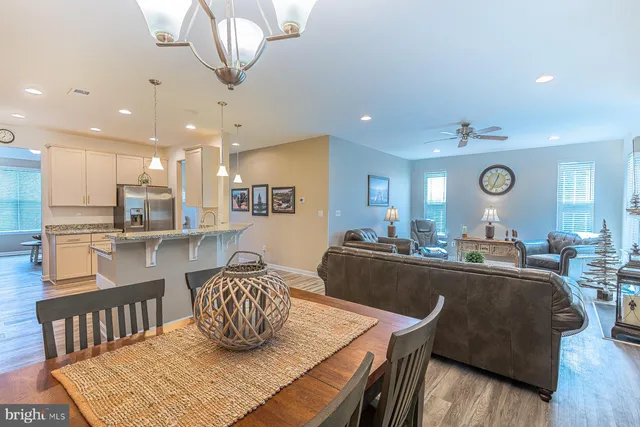 a view of a kitchen with kitchen island a sink and a counter top space
