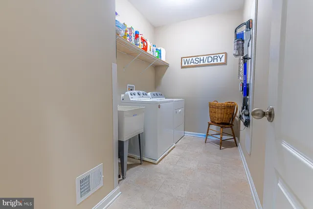 a view of a hallway with workspace and a bedroom
