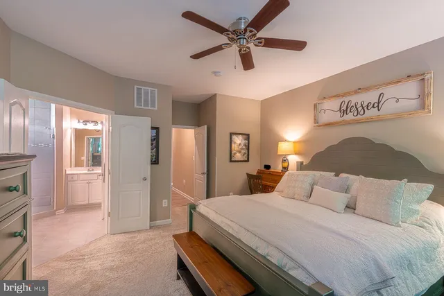 a bedroom with a bed and a flat screen television