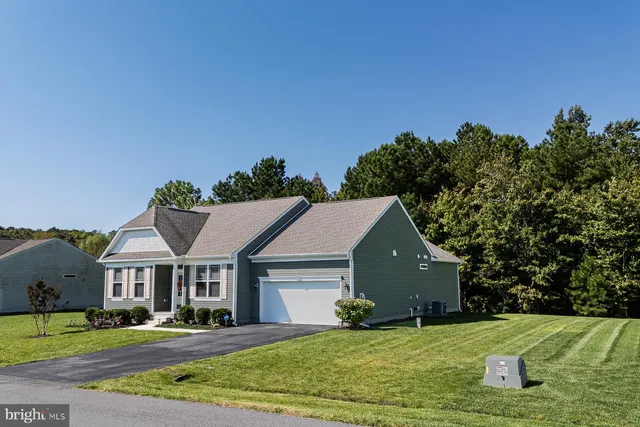 a aerial view of a house with a yard