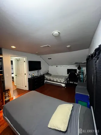 a kitchen with stainless steel appliances kitchen island granite countertop a refrigerator and a stove