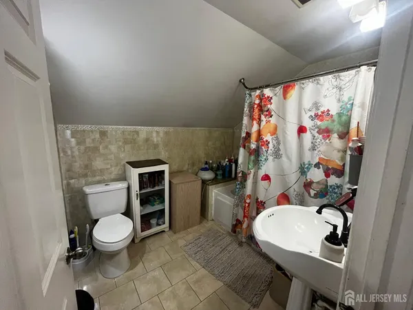a bathroom with a toilet and a sink