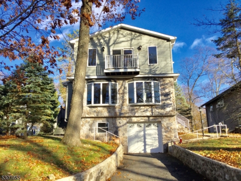 a front view of a house with swimming pool
