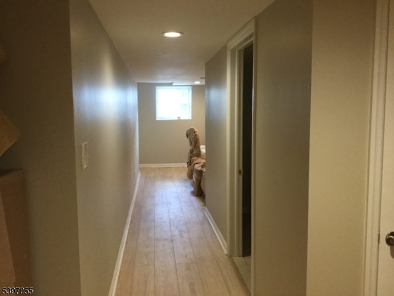 592 Dell Road Landing, NJ 07850 - Photo 16 of 39 a view of a hallway with wooden floor