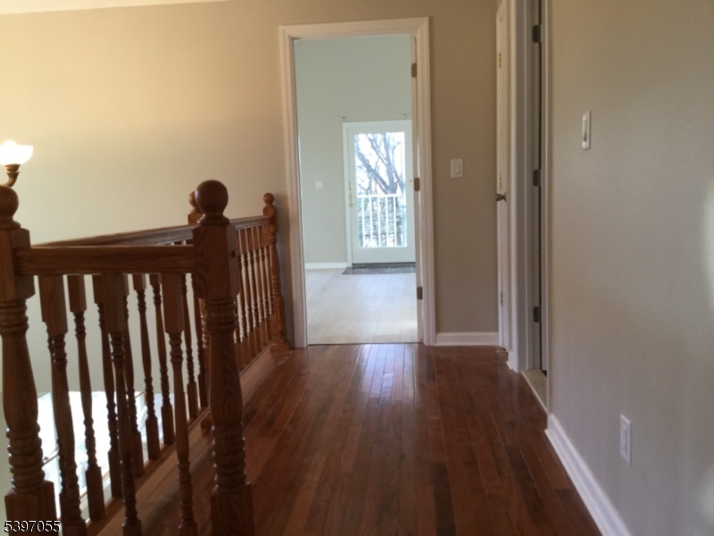 592 Dell Road Landing, NJ 07850 - Photo 25 of 39 a view of a hallway with wooden floor